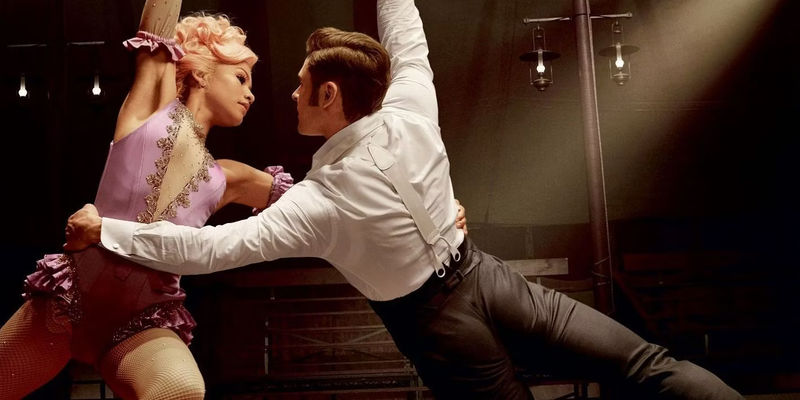 Anne Wheeler (Zendaya) & Phillip Carlyle (Zac Efron) doing acrobatics in The Greatest Showman.