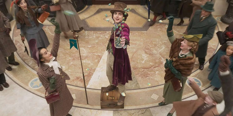Timothee Chalamet with flying candy in Wonka.