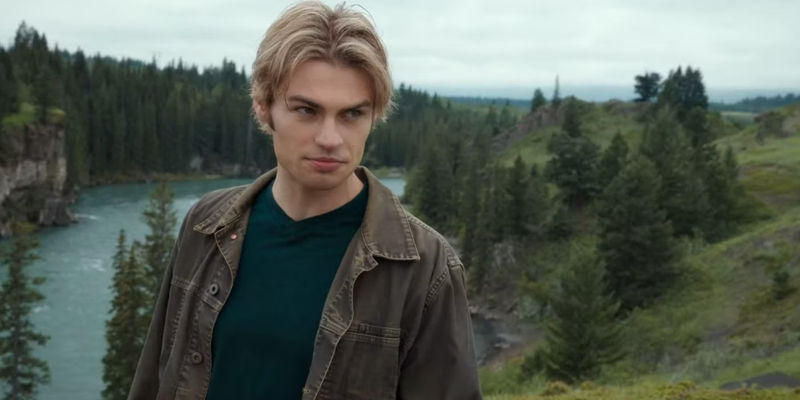 Cole (Noah LaLonde) looking smug in nature with trees and water behind him in My Life with the Walter Boys