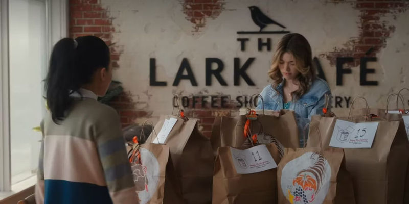 Erin (Alisha Newton) and Jackie (Nikki Rodriguez) at the Lark with bags between them in My Life with the Walter Boys