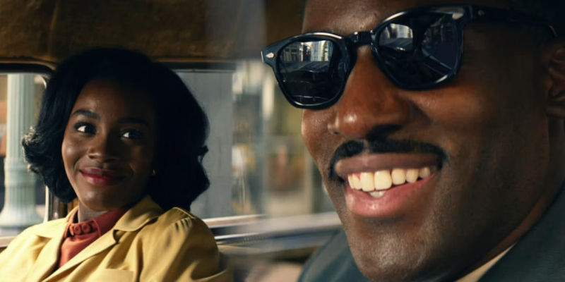 Ashley Thomas as Henry Emory smiling with a lady looking at him in THEM