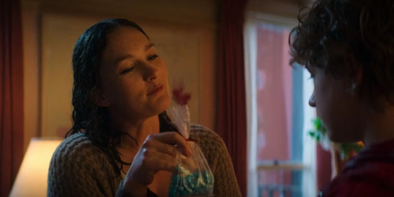 Sally holding a bag of blue candy in Percy Jackson and the Olympians episode 1