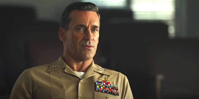 Jon Hamm as Cyclone in Top Gun Maverick in a military uniform having a serious conversation