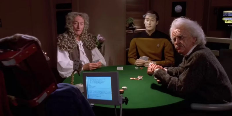 Data, Isaac Newton, and Einstein watch as Stephen Hawking speaks in Star Trek TNG