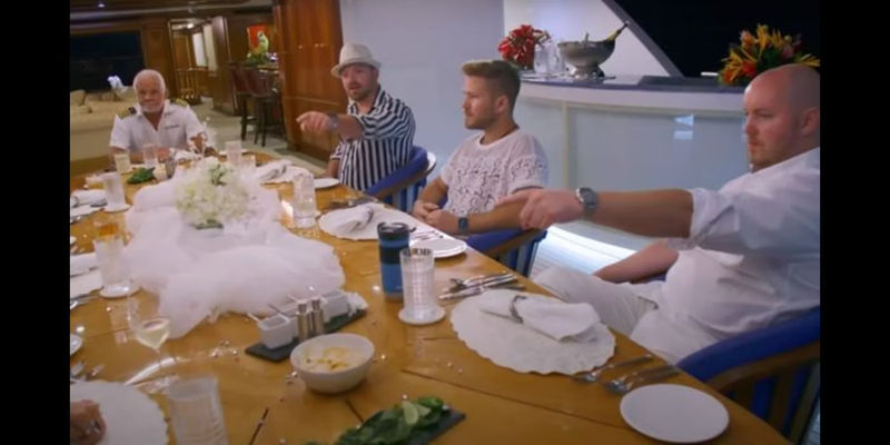 Justin Richards pointing at dinner on Below Deck