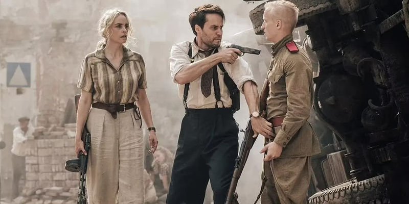 Max with a gun and Elise in The Defeated