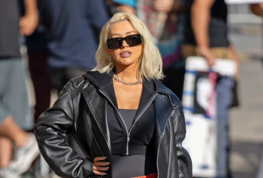 Christina Aguilera Captivates with Daring Style: Jaw-Dropping Mouth-Print Mini and Thigh-High Boot Ensemble Steals the Show on ‘Jimmy Kimmel’