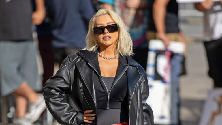 Christina Aguilera Captivates with Daring Style: Jaw-Dropping Mouth-Print Mini and Thigh-High Boot Ensemble Steals the Show on ‘Jimmy Kimmel’