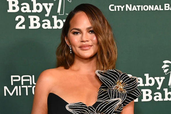 Chrissy Teigen Experiences Wardrobe Mishap as Her Dress Tears Open at