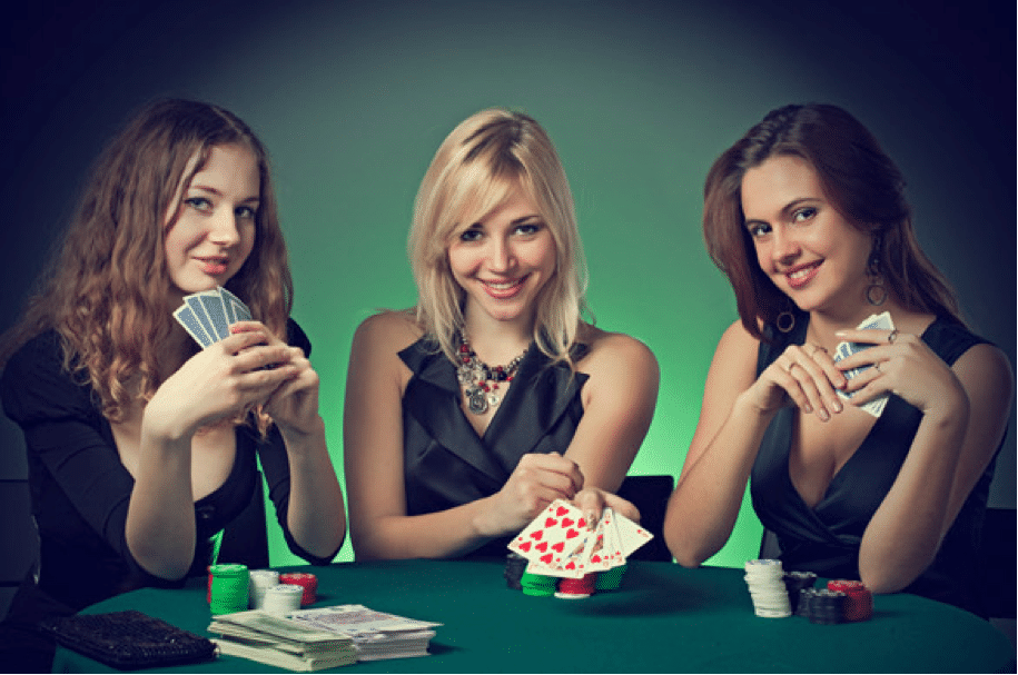 three pretty girls sitting at casino with poker cards