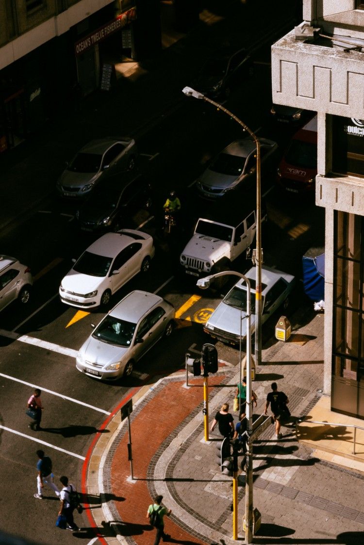 a group of cars driving into traffic