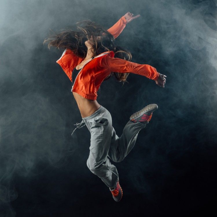 Young African American woman dancing into a pirouette 