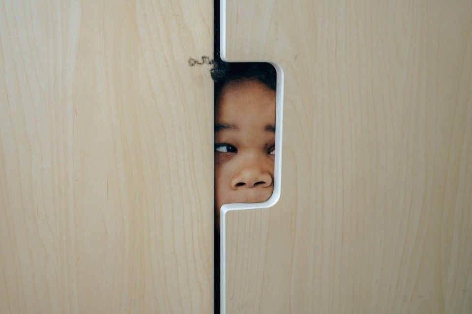 girl hiding in a closet