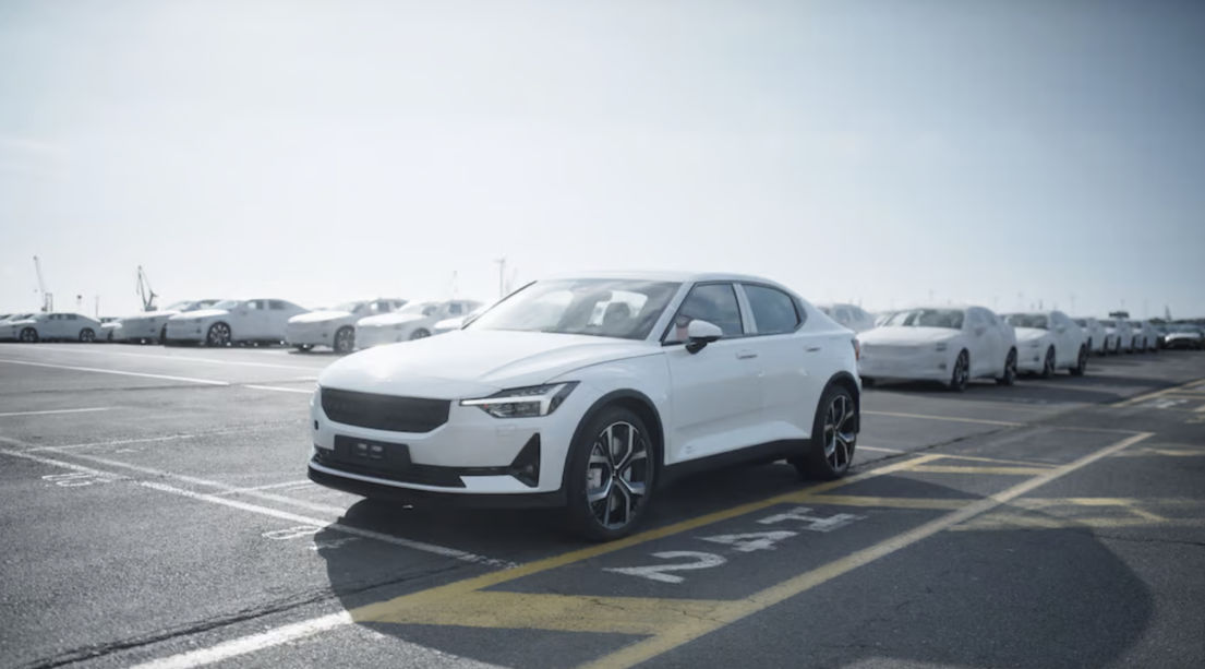 White Polestar cars waiting to be delivered from the wharf.