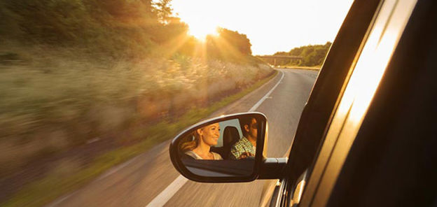 Driving a car looking at the rear view mirror