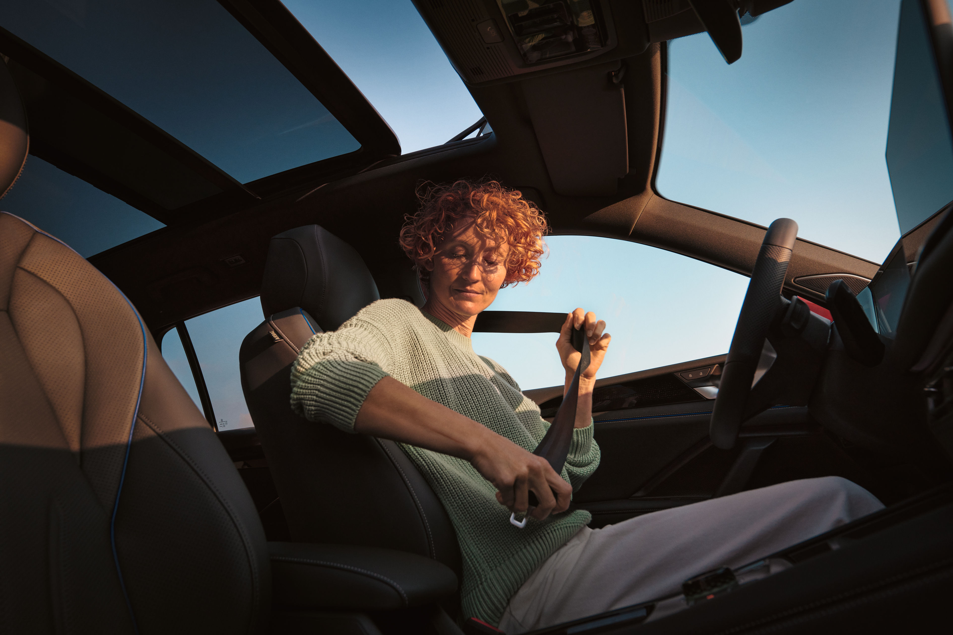 Woman fastening seatbelt