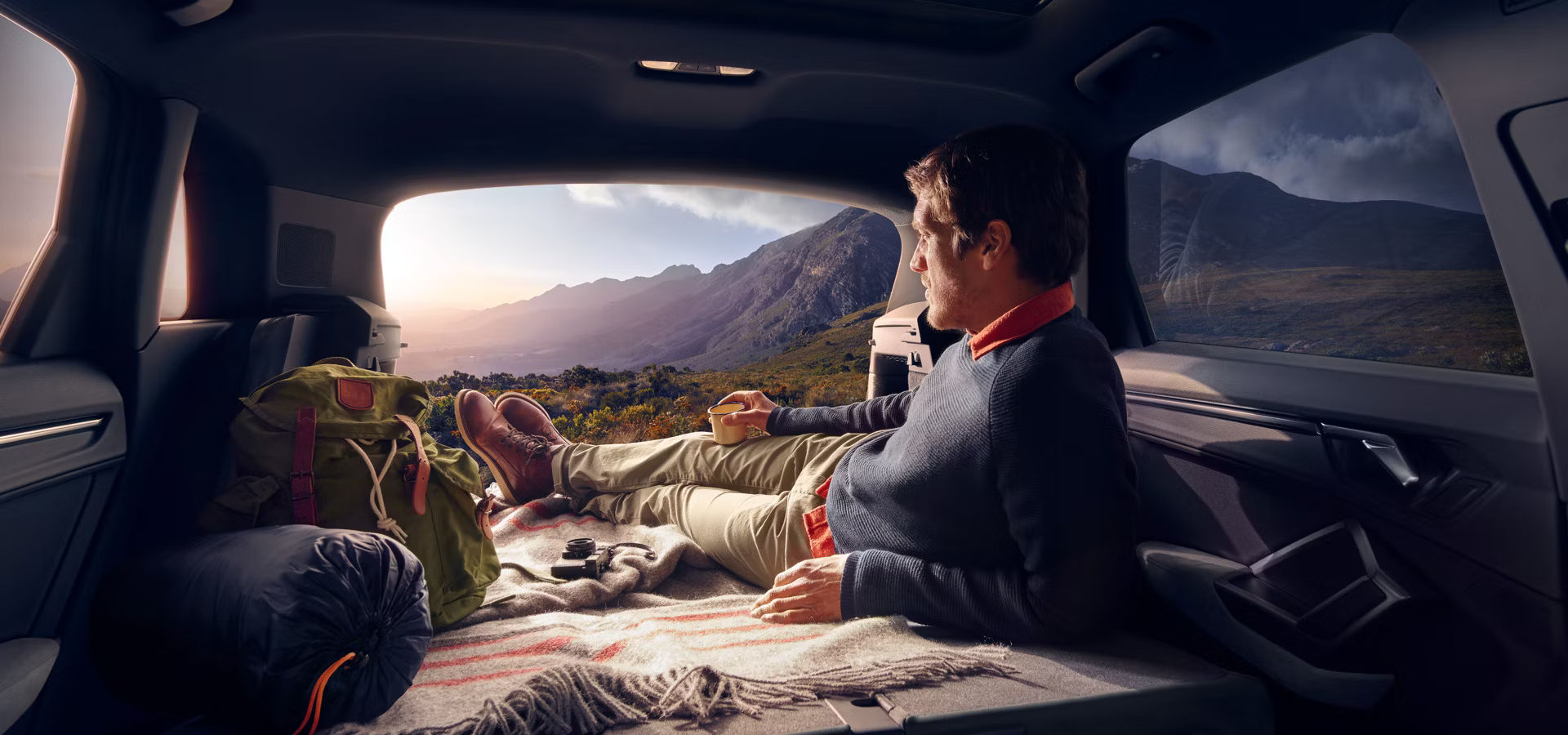 Man lying in the back of an Audi Q3 SUV