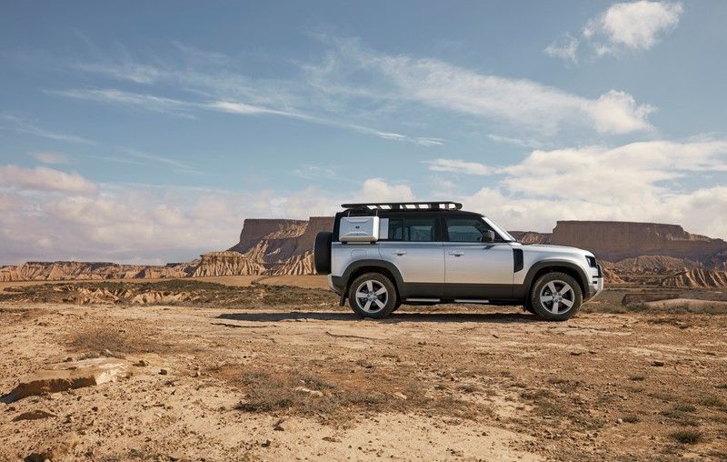 Silver defender parked in desert