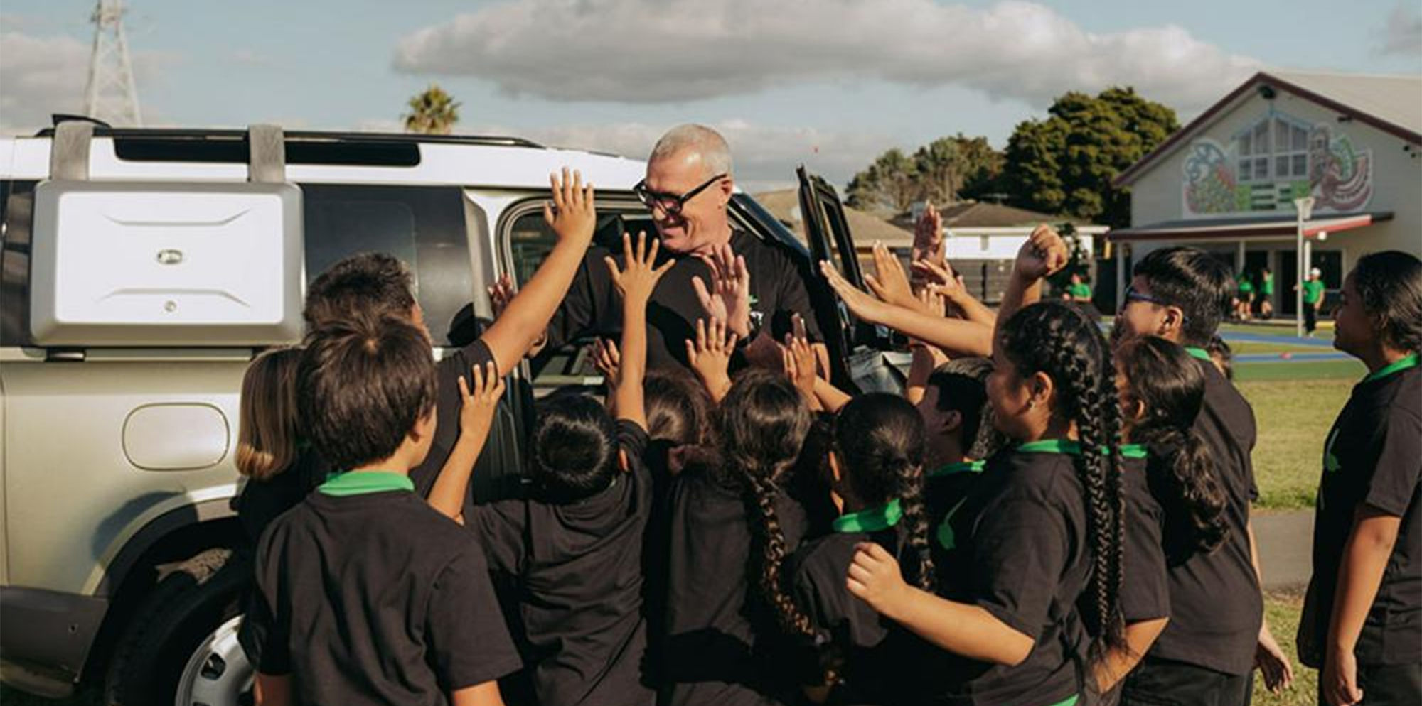 School students taking part in a community activity