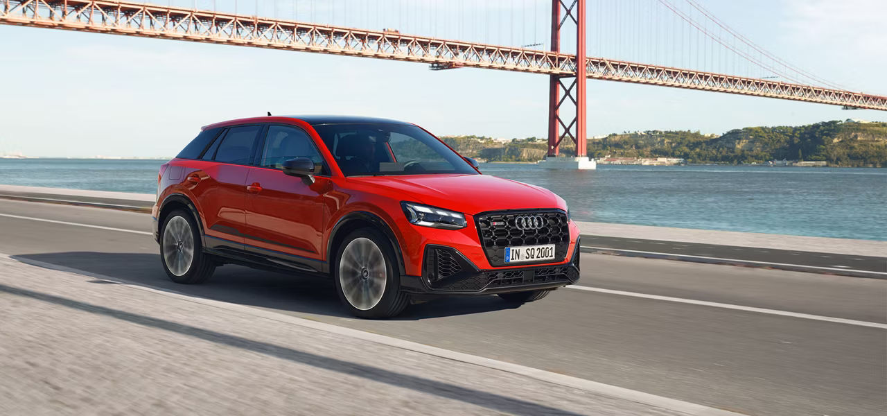 Audi Q2 driving by water