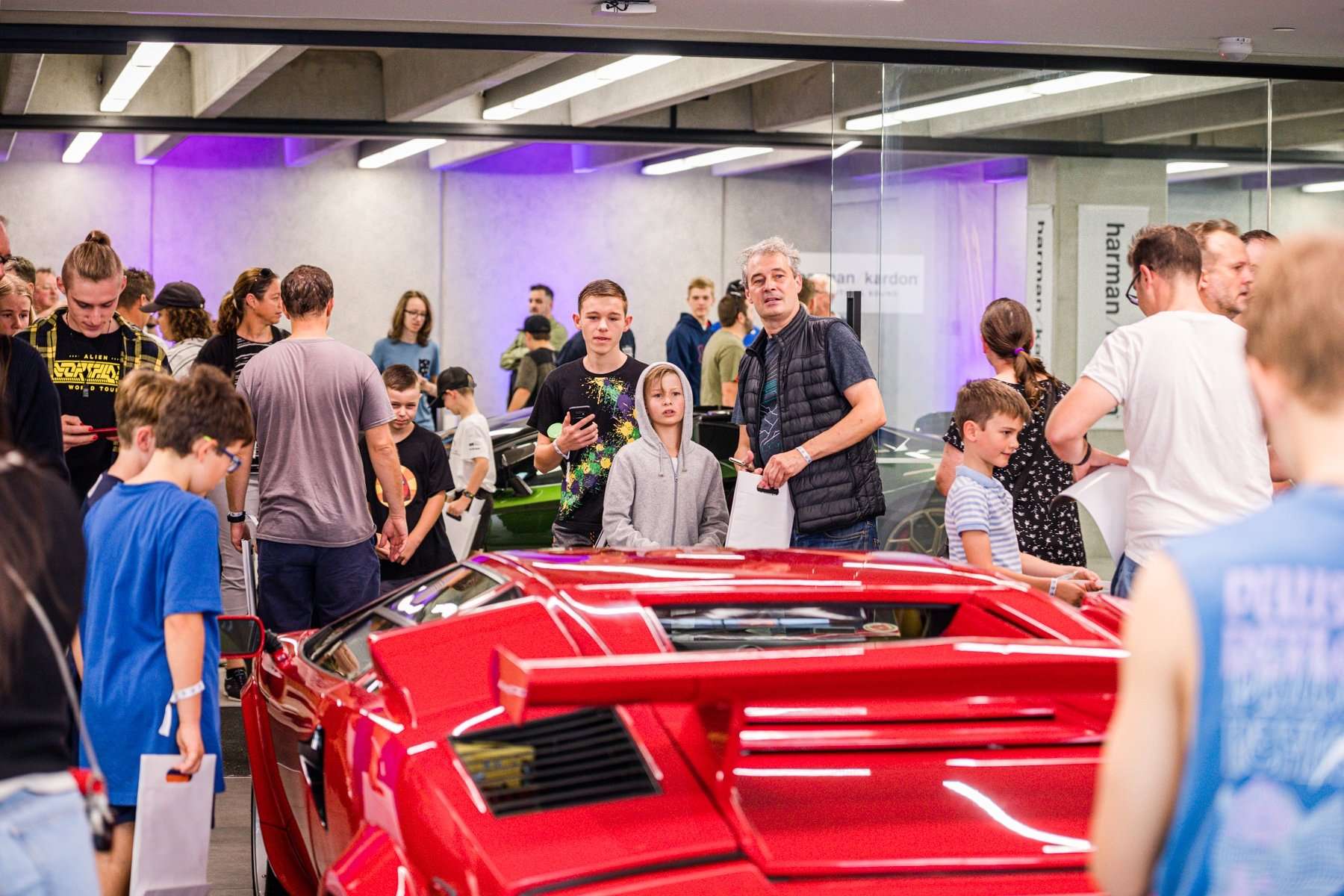 Families and car enthusiasts at the Starship Supercar Show at Giltrap Group headquarters in Grey Lynn