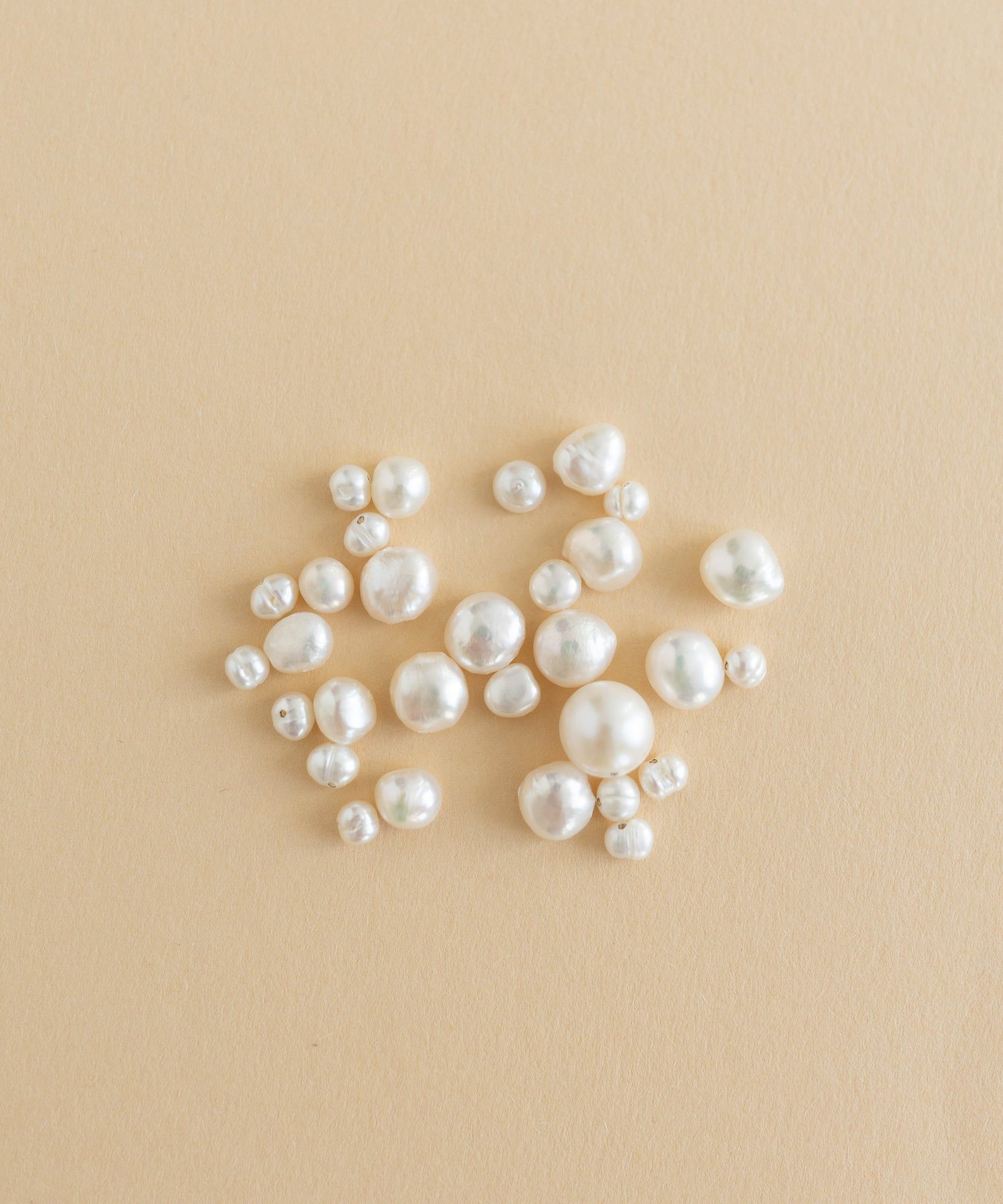 A charm-filled kit of Sweet Water Pearls from WALD World showcased on a beige background.