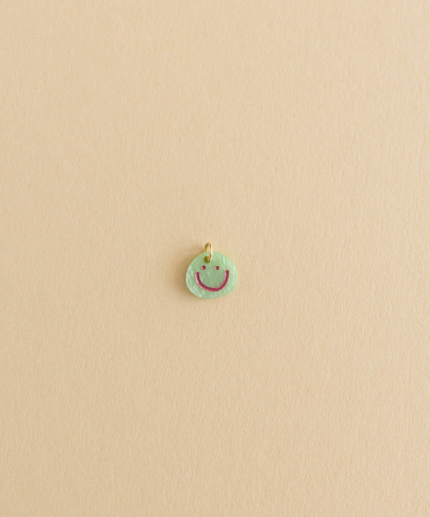 A small Smilie Dude Charm Green diy jewelry from WALD World.