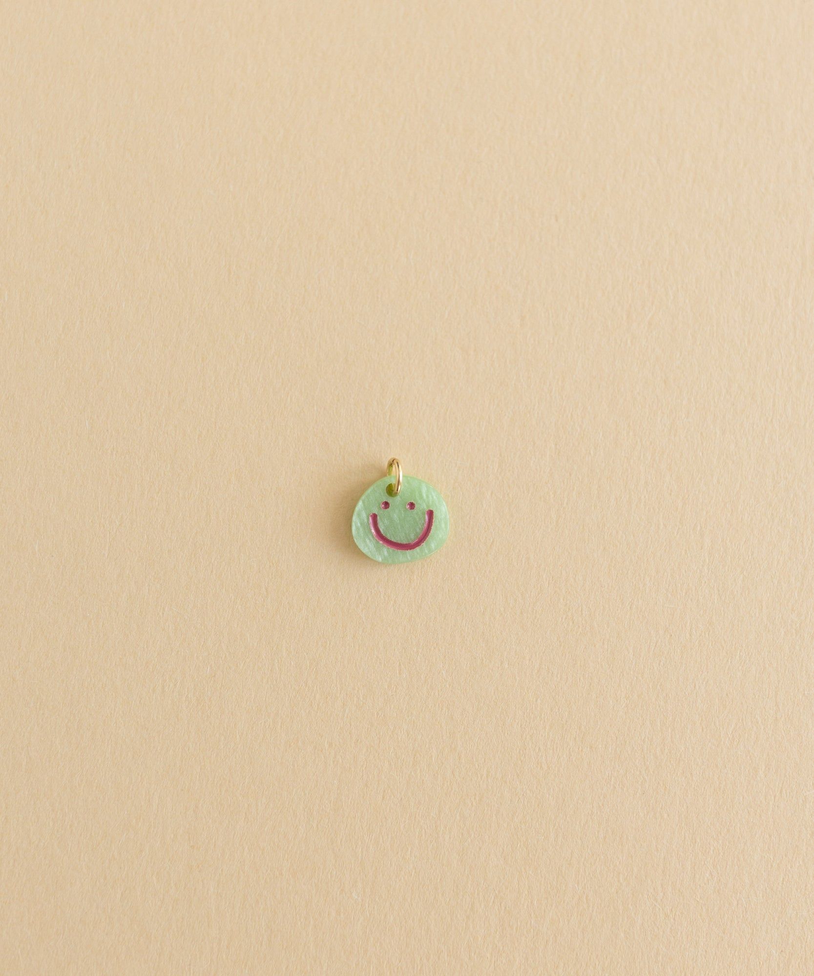 A small Smilie Dude Charm Green diy jewelry from WALD World.