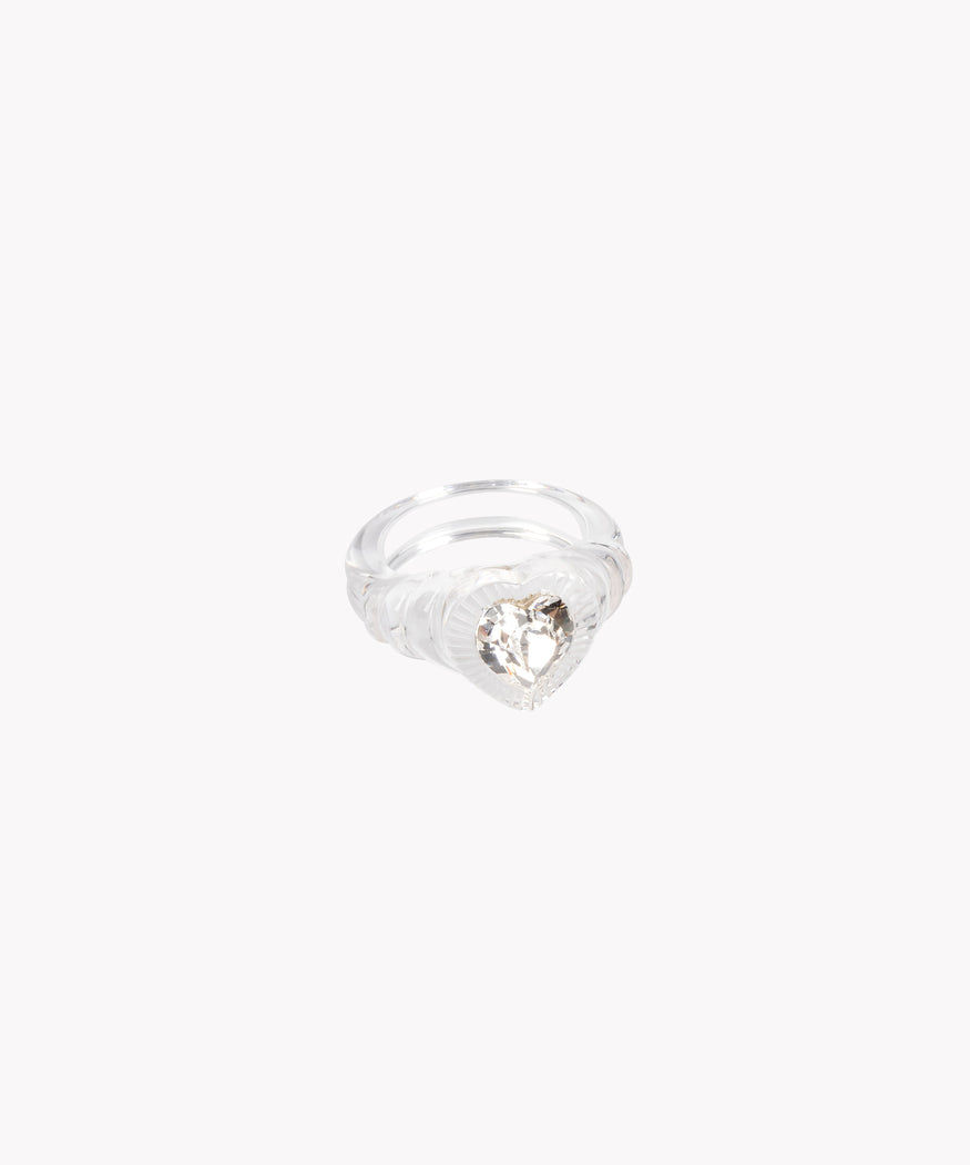 A Be My Lover Transparent Ring by WALD Berlin, perfect for the summer, adorned with a sparkling diamond at its center.