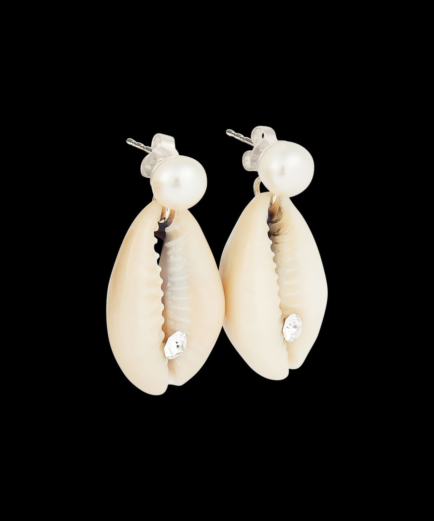 A pair of WALD Berlin La Piscina Just a Friend Pearl Earrings featuring cowrie shells, each adorned with a pearl and a small clear gem.