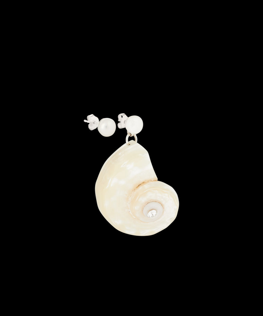 Close-up of a single earring featuring a pearl stud and a large, spiral seashell pendant with a central gem, meticulously crafted in gold-plated sterling silver. The La Piscina Paris Paris Earring by WALD Berlin.