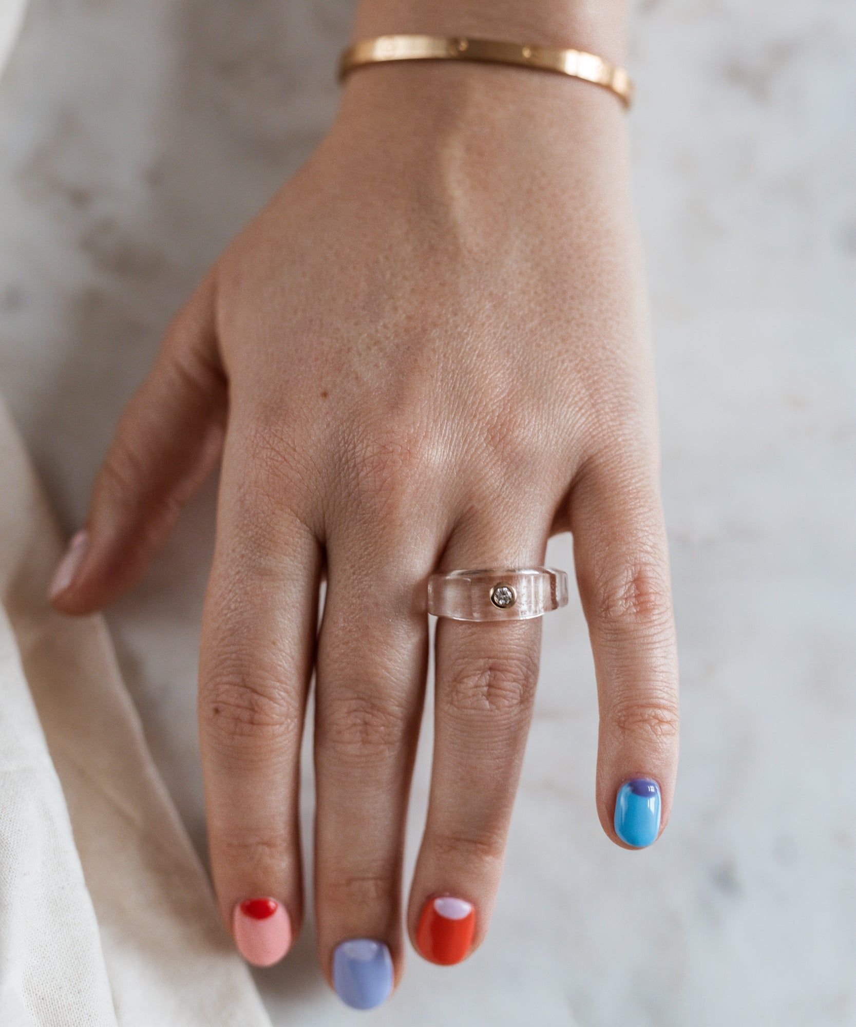 A woman's hand in Berlin adorned with a Shining Star Fine Jewelry Crystal Ring from WALD.