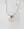 The Smilie Dude Medaillon Gold Necklace from WALD Berlin features an 18k gold-plated chain adorned with a round smiley medallion pendant against a white marble backdrop, crafted with precision and elegance. Made in Germany, it beautifully combines playful charm with sophisticated artistry.