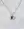 The WALD Berlin Mom Swarovski Bi Color Heart Necklace features an 18k gold plated chain and a silver heart-shaped pendant with three sparkling Swarovski stones, displayed on a light marble surface.