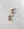 The WALD Berlin Pop Wave Earrings Big are gold plated brass creoles with a ridged design and 925 silver pin, displayed on a white marble surface.