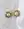 The Pop Soleil Earrings by WALD Berlin, featuring round 18k gold plating and wax pearl centers, are displayed on a marble surface beside a white cloth.