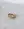 The WALD Berlin Mom Swarovski Heart Ring, adorned with a sparkling heart-shaped Swarovski stone, rests elegantly on a light marble surface.