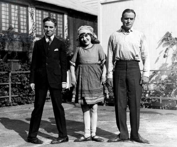 Charlie Chaplin, Mary Pickford and her husband Douglas Fairbanks Sr gagging it up on a studio lot, 1921