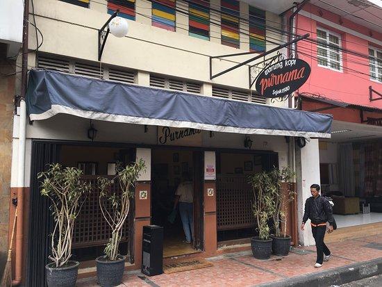 The front appearance of Warung Kopi Purnama, which is still preserved in its original state.