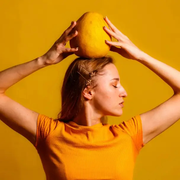 Nadya Besson posing with a yellow background