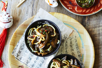 Hoisin beef with shitake, noodles and spring onion dressing