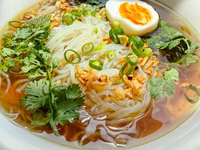 Chicken Broth Rice Noodle Soup, Garlic Oil, Mint and a Boiled Egg