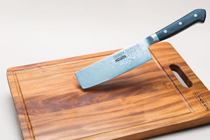 Cleaver and wooden chopping board