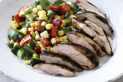 Marinated chicken thighs with a salsa salad recipe from Changs