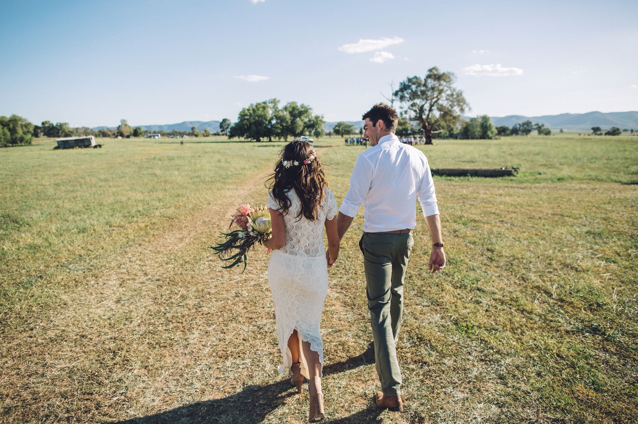 Couple holding hands after wedding ceremony pondering their life ahead