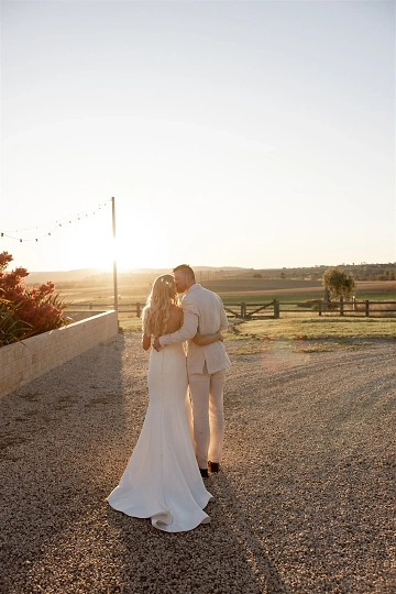 Newlyweds enjoying having their wedding portraits taken during golden hour at BoxGrove Bathurst.