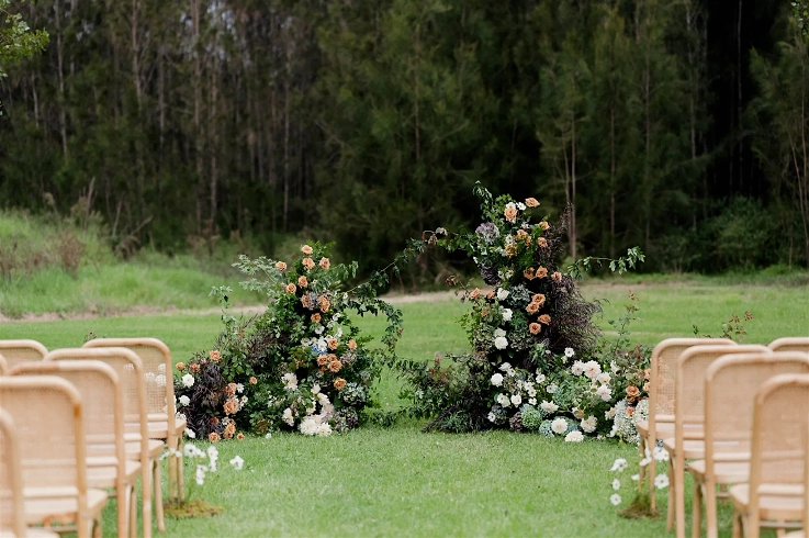 A beautiful outdoor ceremony set-up in the gardens at McGuigan House.