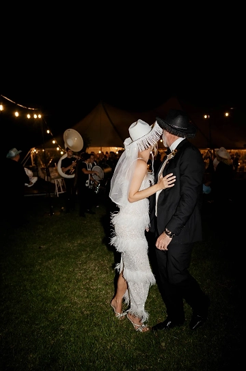 This couple threw a surprise cowboy disco wedding after-party at McGuigan House.