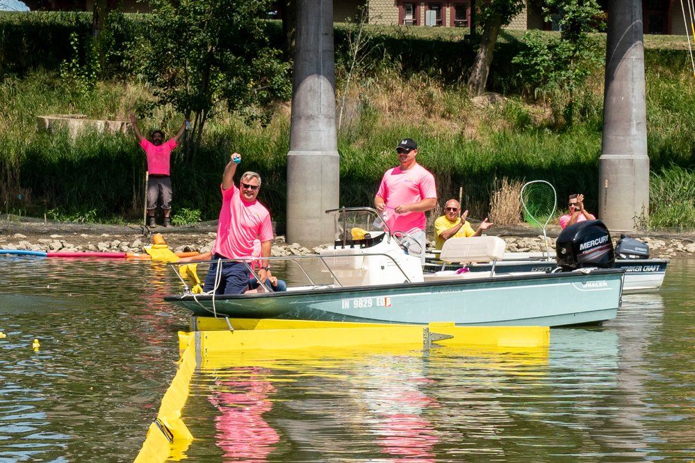 Weigand Duck Race participants at the river