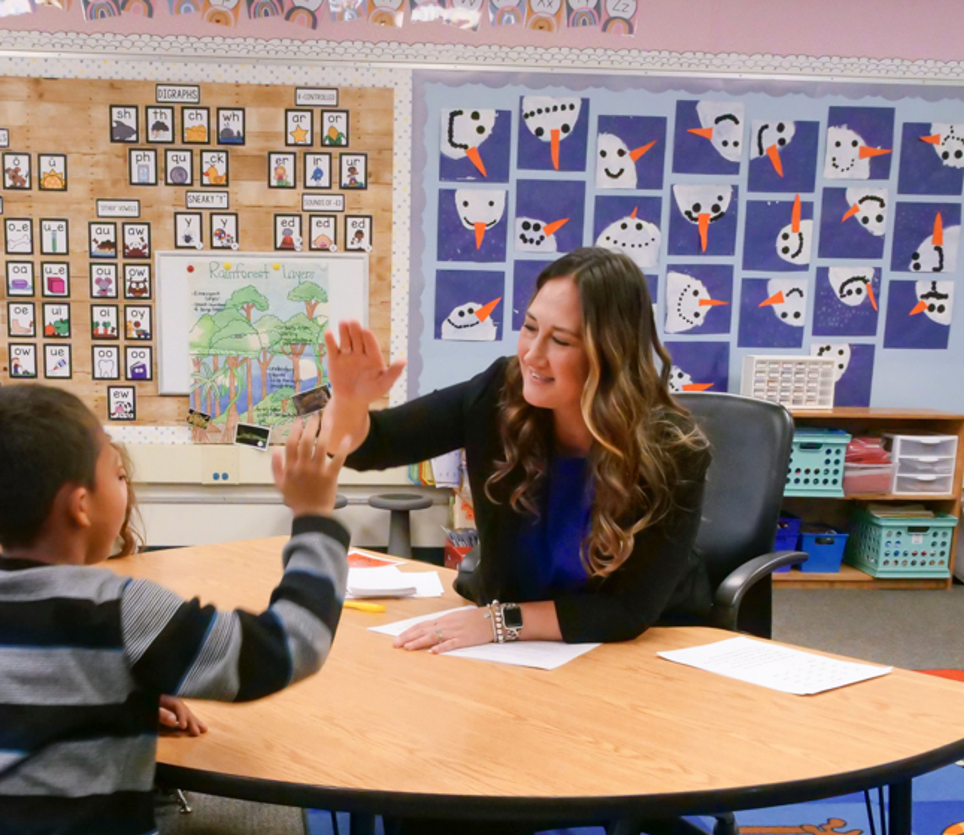 Teacher giving student a high five